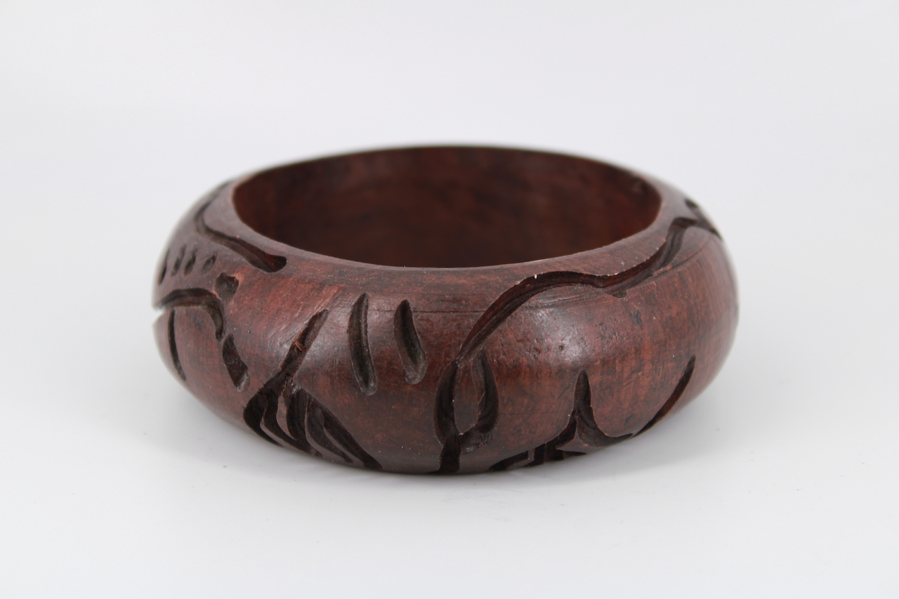 Wooden-bracelet.jpg Hand-Carved Wooden Stand – Decorative Display Holder with Carved Details - Image 1