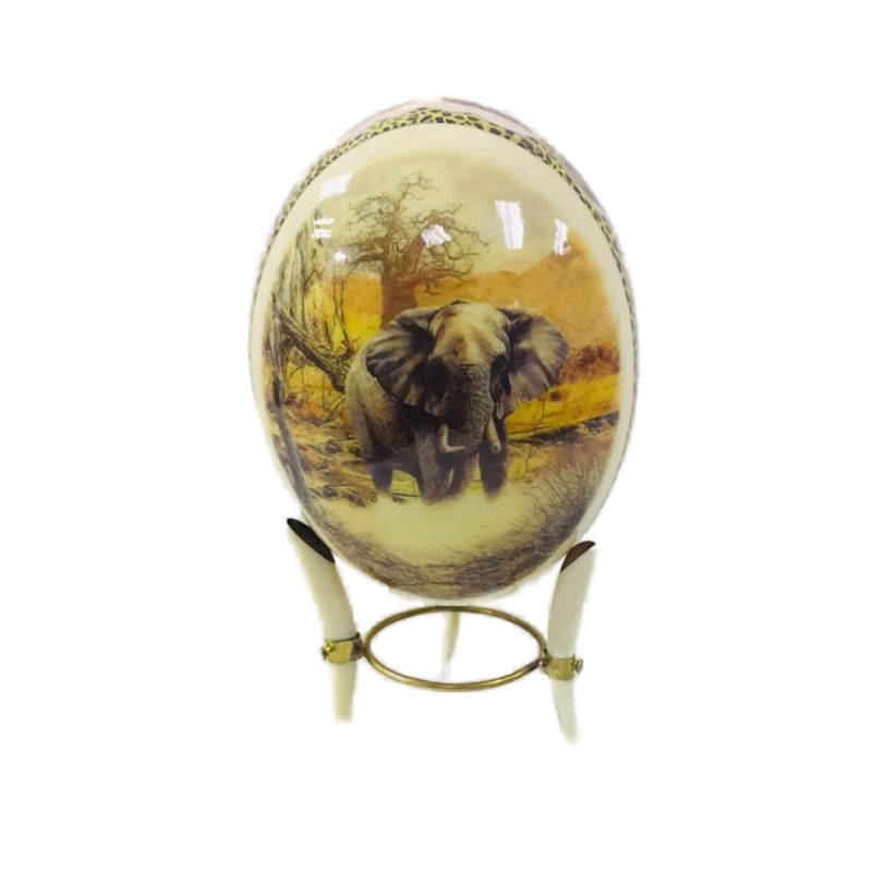 elephantonOstritchEgg.jpg Ostrich Egg Tusk Stand with Decorated Ostrich Egg - Image 1